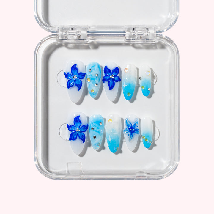 Blue Porcelain nail set with white base and 3D blue floral designs, inspired by traditional Chinese porcelain.