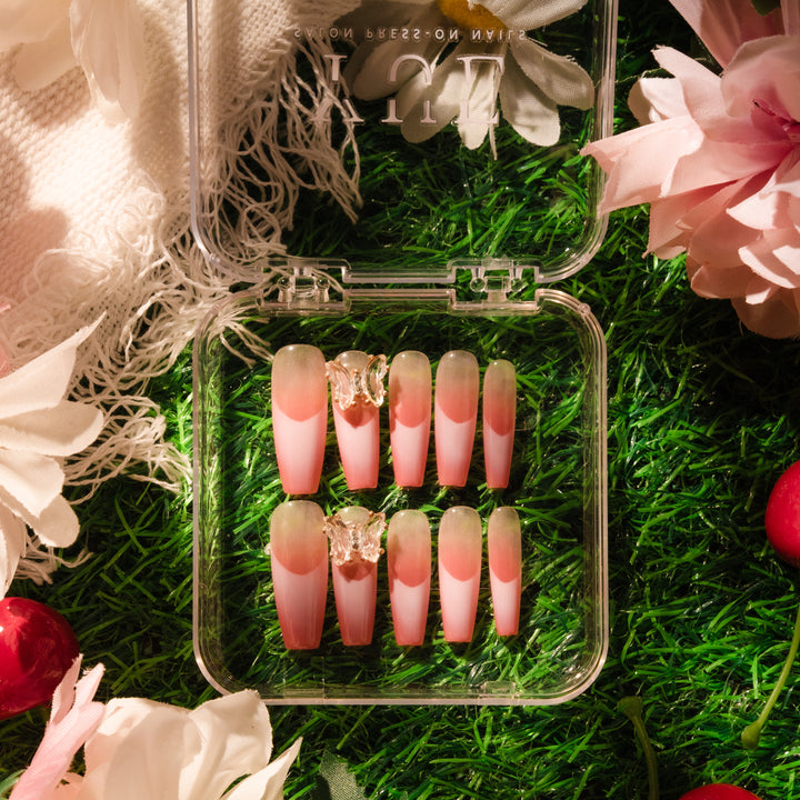 Isabelle Press-On Nails with peach-pink gradient base, 3D transparent butterfly decorations, perfect for springtime and nature-inspired looks.