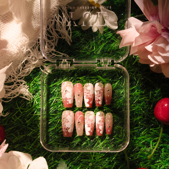 Spring Sakura with translucent to sakura pink gradient, hand-painted sakura, rhinestone accents, and coffin shape.